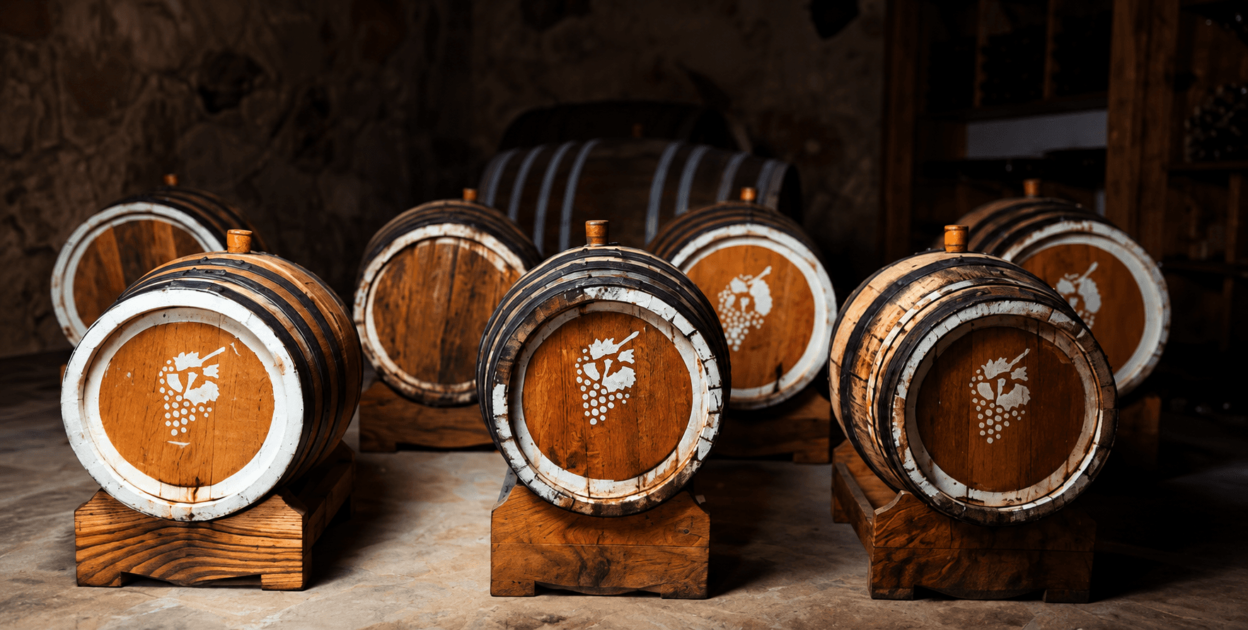Small wooden barrels marked with a grape cluster